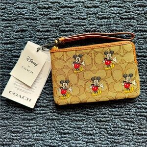 Coach x Disney Corner Zip Wristlet Mickey Mouse Signature Jacquard Logo CN033